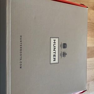 Kids size uk4 black hunter boots in box.